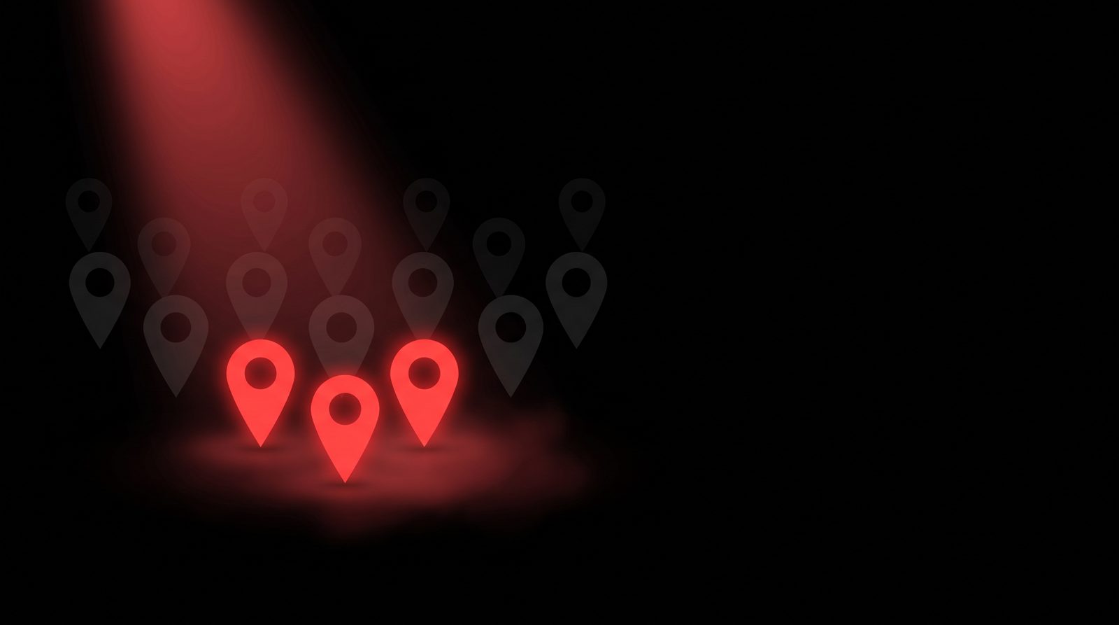 Three businesses lit up, the rest fading into the dark